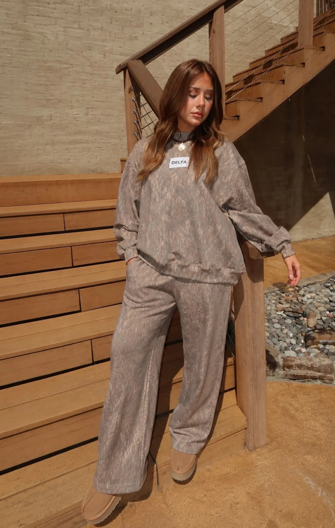 Model wearing Delta Dark Camo Mockneck Pant Set